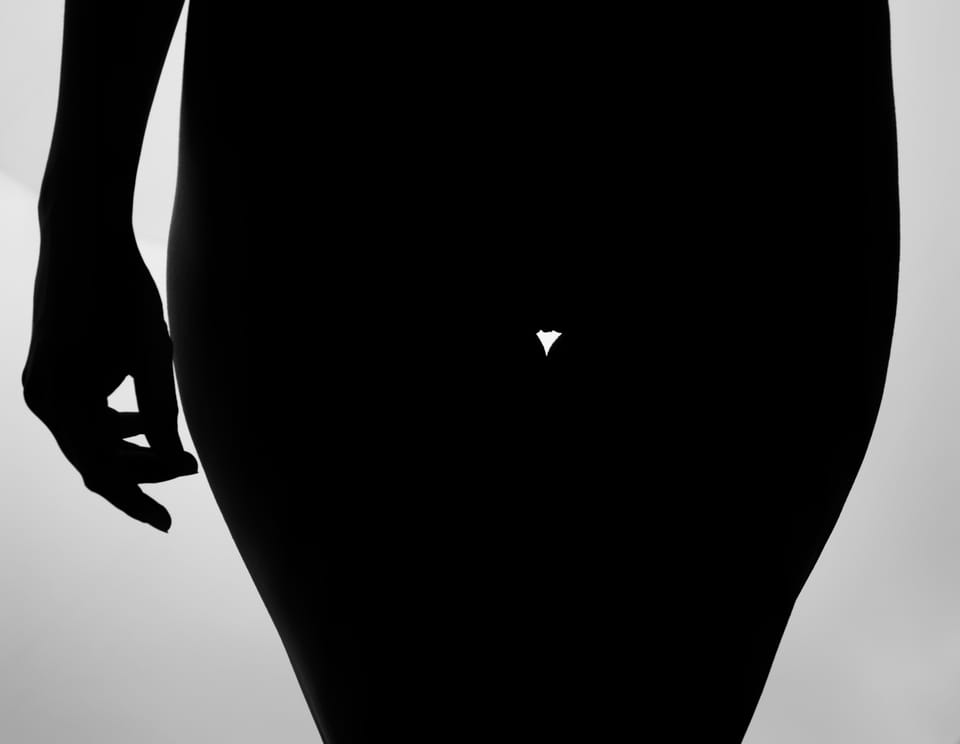 Another of the backlit studies, the body reduced to one unbroken black field